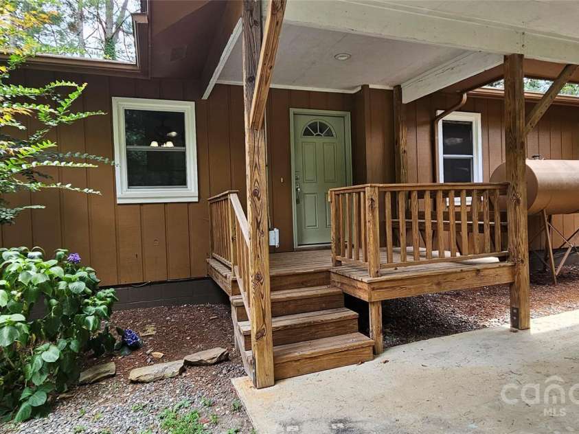 205 Blackwood Road, Cullowhee, NC 28723.  MLS# CAR4249157, YatesRealty ID 22339. Carport entrance with new door