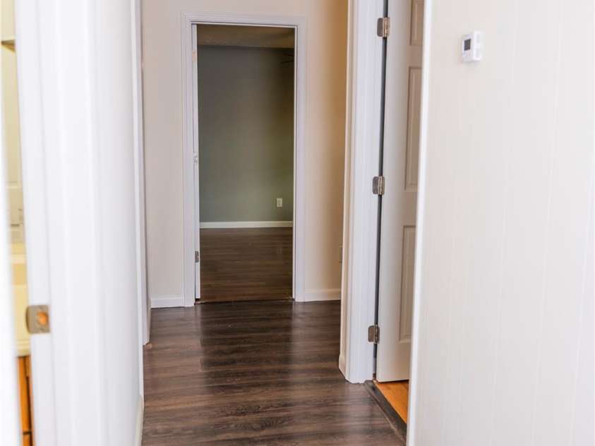 205 Blackwood Road, Cullowhee, NC 28723.  MLS# CAR4249157, YatesRealty ID 22339. Hallway to Bedrooms 2, 3, and 4