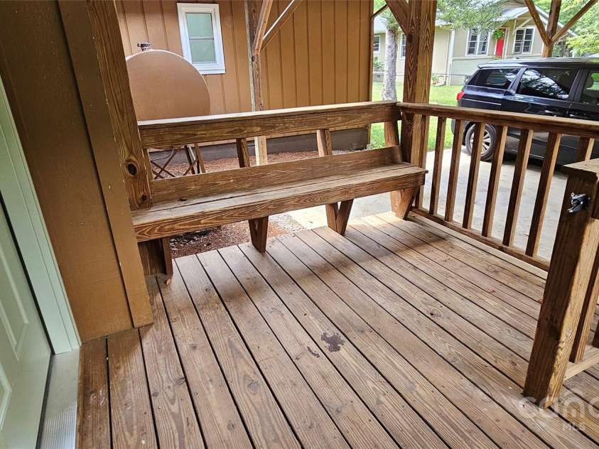 205 Blackwood Road, Cullowhee, NC 28723.  MLS# CAR4249157, YatesRealty ID 22339. Seating area on carport porch