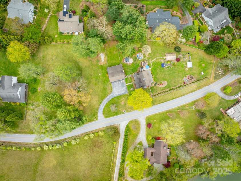 756 Price Road, Hendersonville, NC 28739.  MLS# CAR4208399, YatesRealty ID 22341. Aerial of 1.64 acre property over Price Rd.
