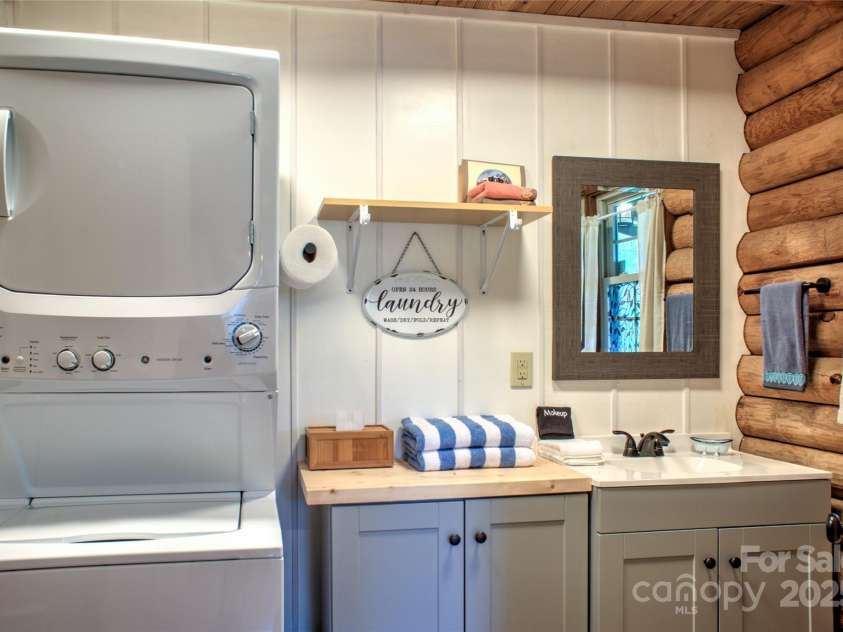 756 Price Road, Hendersonville, NC 28739.  MLS# CAR4208399, YatesRealty ID 22341. Laundry + Half bath off kitchen