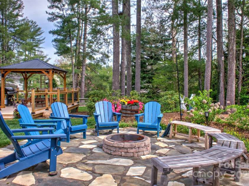 756 Price Road, Hendersonville, NC 28739.  MLS# CAR4208399, YatesRealty ID 22341. Stone circle Fire pit