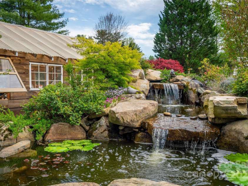 756 Price Road, Hendersonville, NC 28739.  MLS# CAR4208399, YatesRealty ID 22341. Waterfall, lilypad pond