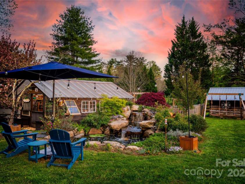 756 Price Road, Hendersonville, NC 28739.  MLS# CAR4208399, YatesRealty ID 22341. Waterfall with lilypads, Greenhouse