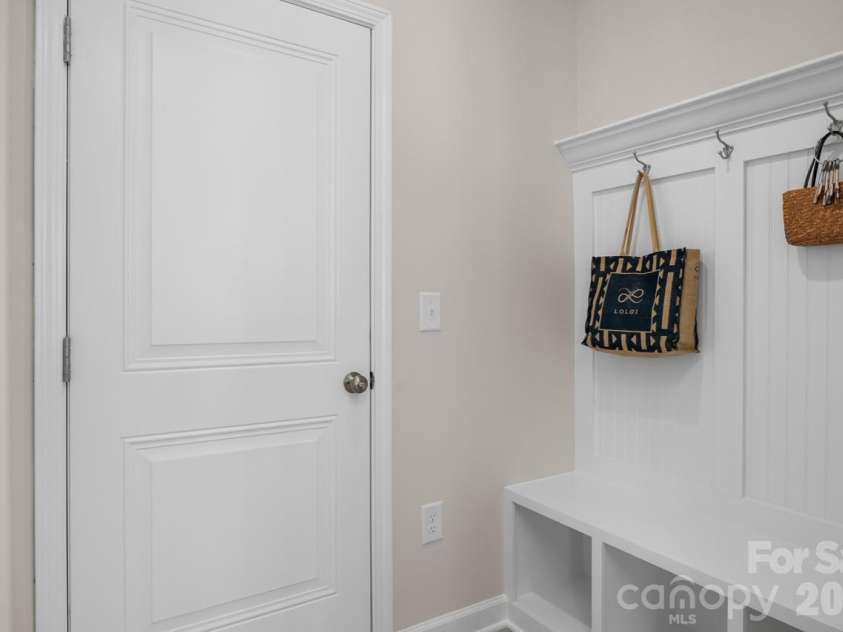 2917 audubon Ridge, Belmont, NC 28012.  MLS# CAR4356403, YatesRealty ID 22344. Mud room bench at garage entry