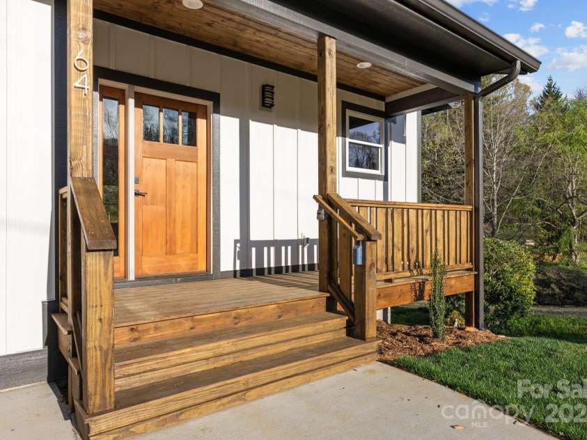 64 Pinedale Road, Asheville, NC 28805.  MLS# CAR4210375, YatesRealty ID 2235. Front porch, perfect for a few rocking chairs