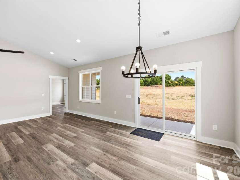 1008 Speight Road, Albemarle, NC 28001.  MLS# CAR4377011, YatesRealty ID 22352. Dining by the Walk-out Porch Access