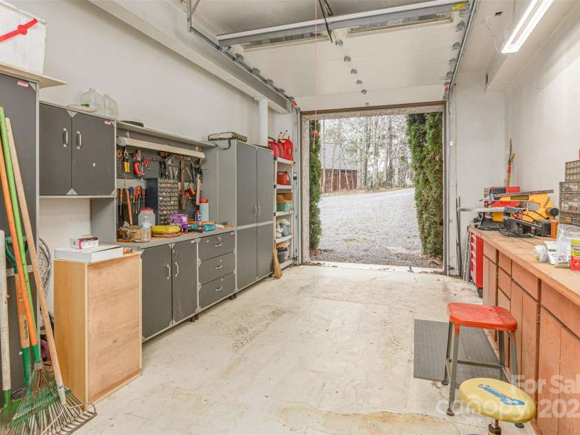 526 Grand Oaks Drive, Hendersonville, NC 28792.  MLS# CAR4239687, YatesRealty ID 22359. 3rd Car or Golf Cart/ATV Parking. Workshop.  11 Ft Ceilings.