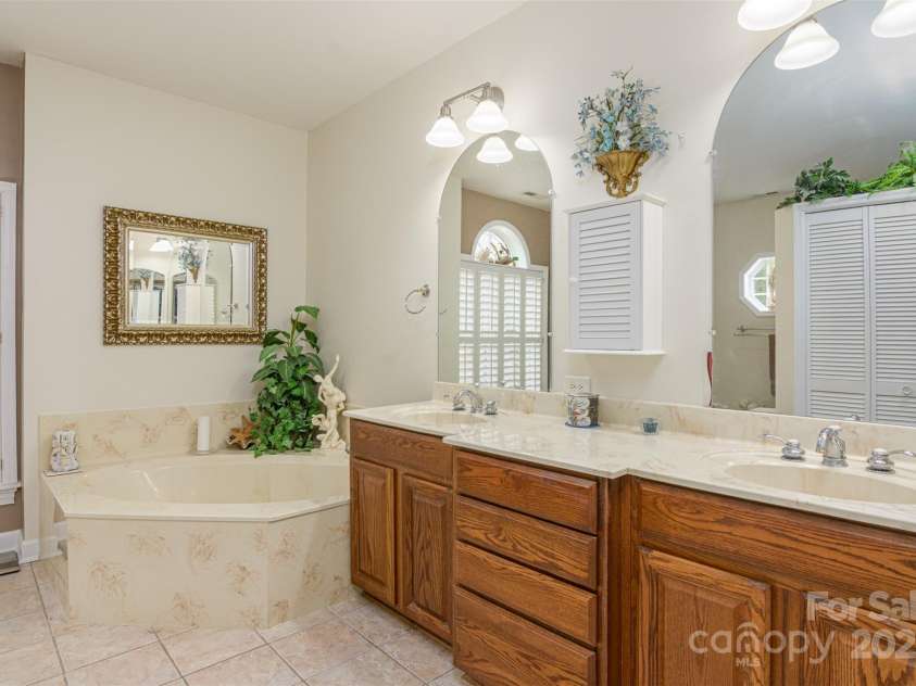526 Grand Oaks Drive, Hendersonville, NC 28792.  MLS# CAR4239687, YatesRealty ID 22359. Expansive His & Hers Vanity
