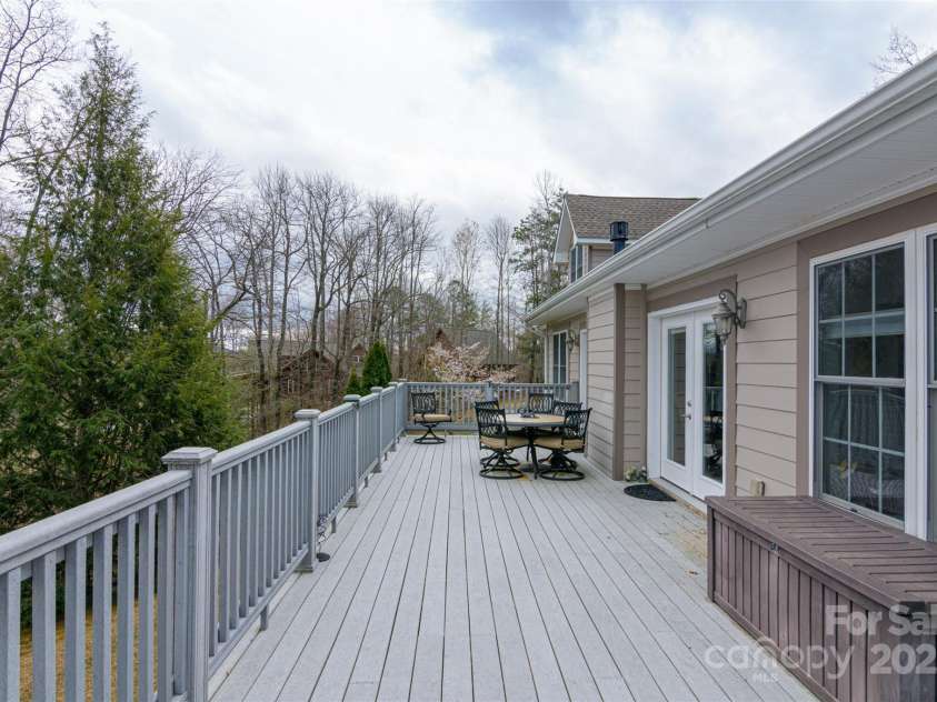 526 Grand Oaks Drive, Hendersonville, NC 28792.  MLS# CAR4239687, YatesRealty ID 22359. Full Length wrap-Around Decks