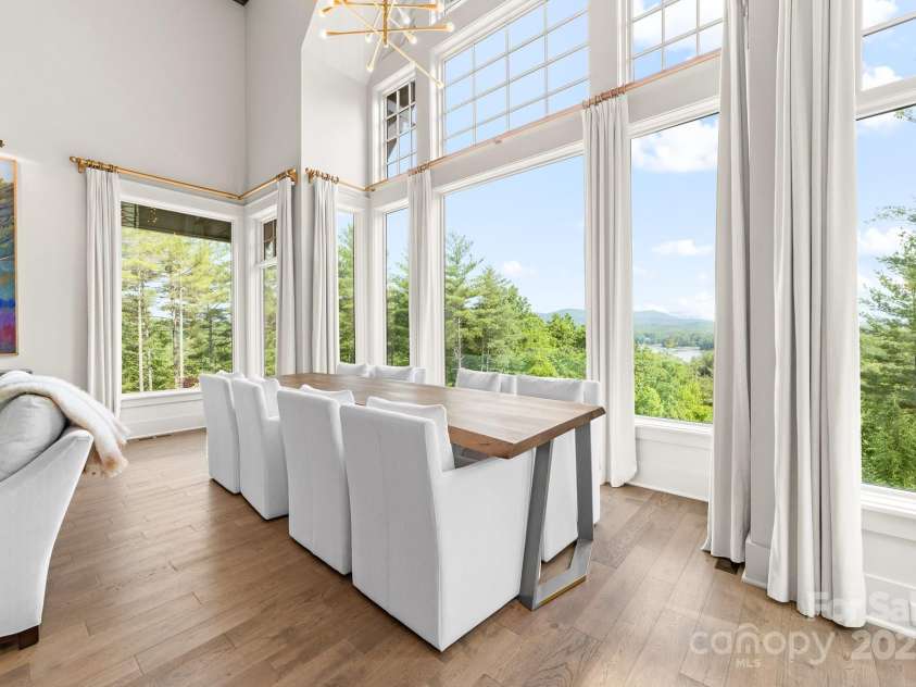 68 Cinch Knot Drive, Nebo, NC 28761.  MLS# CAR4233155, YatesRealty ID 22370. Abundant light fills the dining and living area while the expansive windows provide a full view of nature.