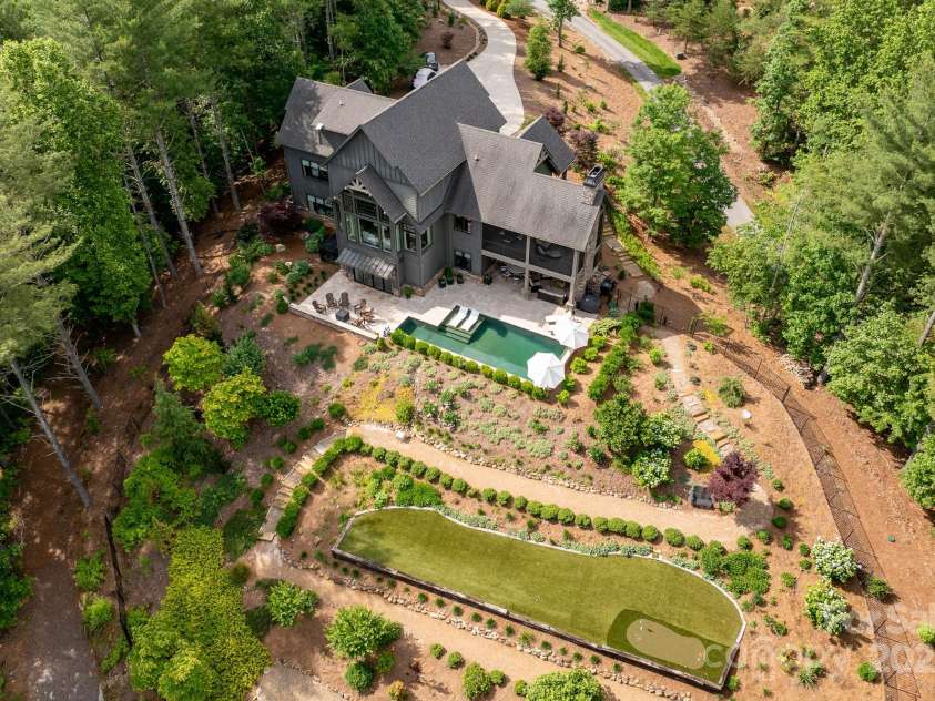 68 Cinch Knot Drive, Nebo, NC 28761.  MLS# CAR4233155, YatesRealty ID 22370. Enchanting landscaping and terraced gardens create your private sanctuary.