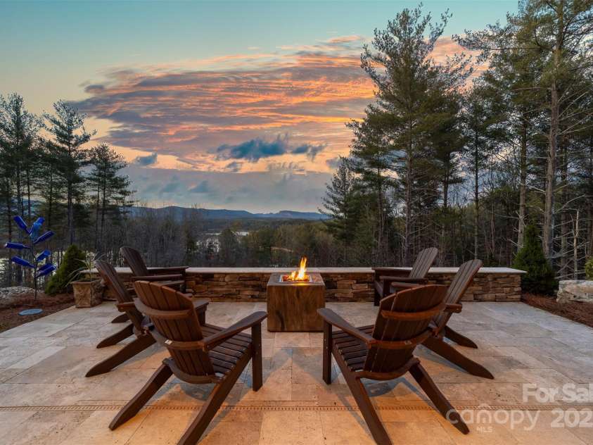 68 Cinch Knot Drive, Nebo, NC 28761.  MLS# CAR4233155, YatesRealty ID 22370. Enjoy sunsets by the firepit overlooking the views.