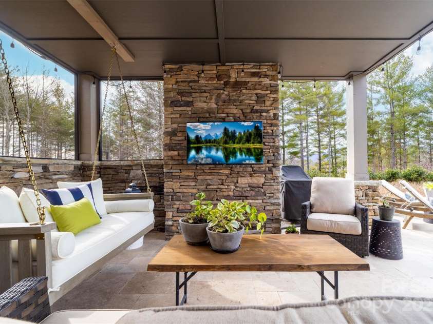 68 Cinch Knot Drive, Nebo, NC 28761.  MLS# CAR4233155, YatesRealty ID 22370. The poolside covered patio area provides shade and relaxation.