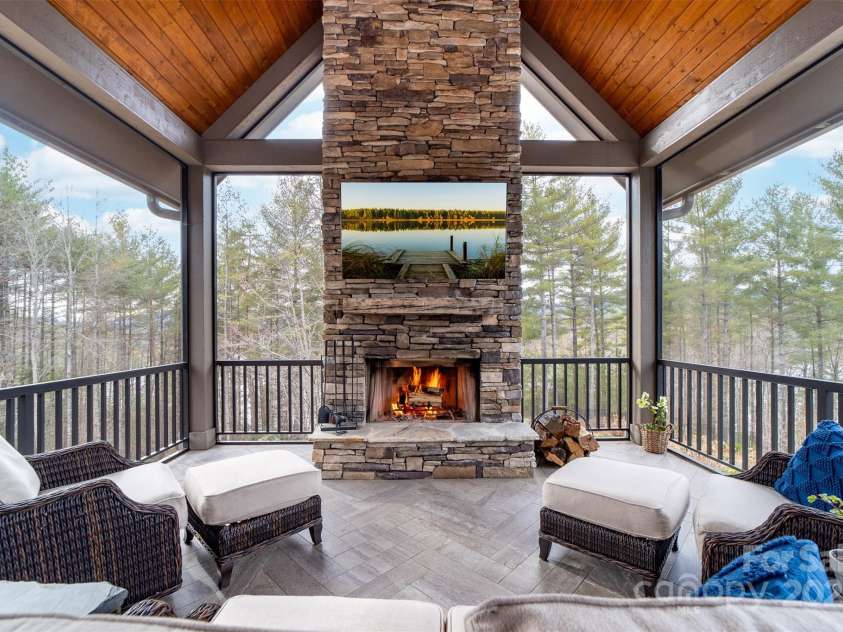 68 Cinch Knot Drive, Nebo, NC 28761.  MLS# CAR4233155, YatesRealty ID 22370. Walk out to the main level screened patio to enjoy the views year-round with wood burning fireplace.