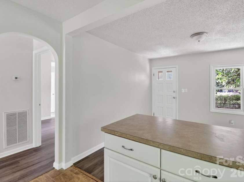 1121 Lundix Street, Albemarle, NC 28001.  MLS# CAR4381009, YatesRealty ID 22372. Kitchen Looking into Living