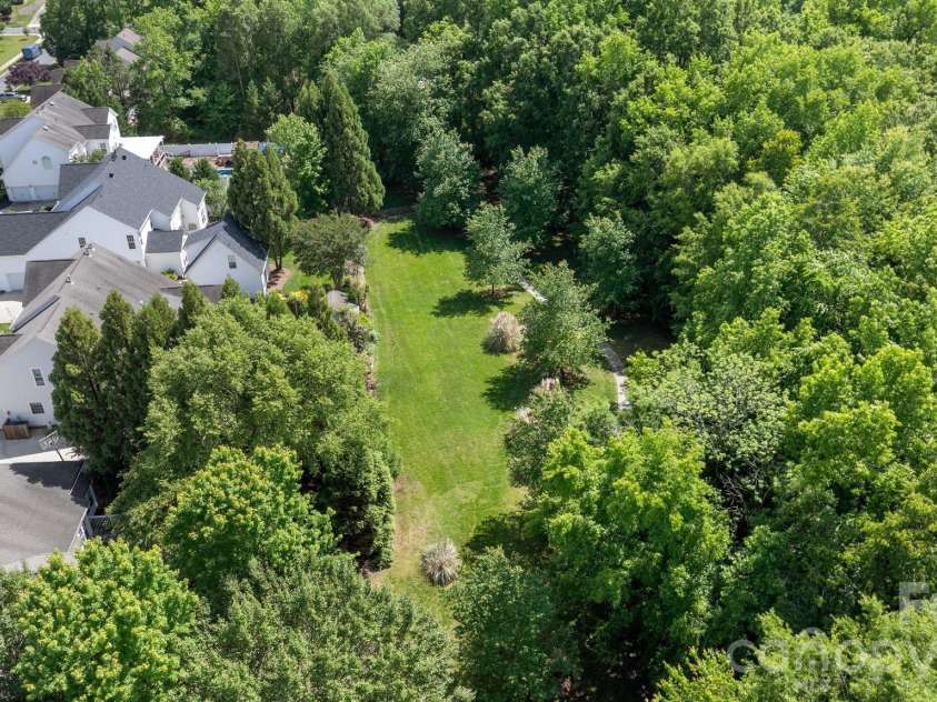 1020 Butterburr Drive, Matthews, NC 28104.  MLS# CAR4377677, YatesRealty ID 22378. 2 Acres Maintained by HOA