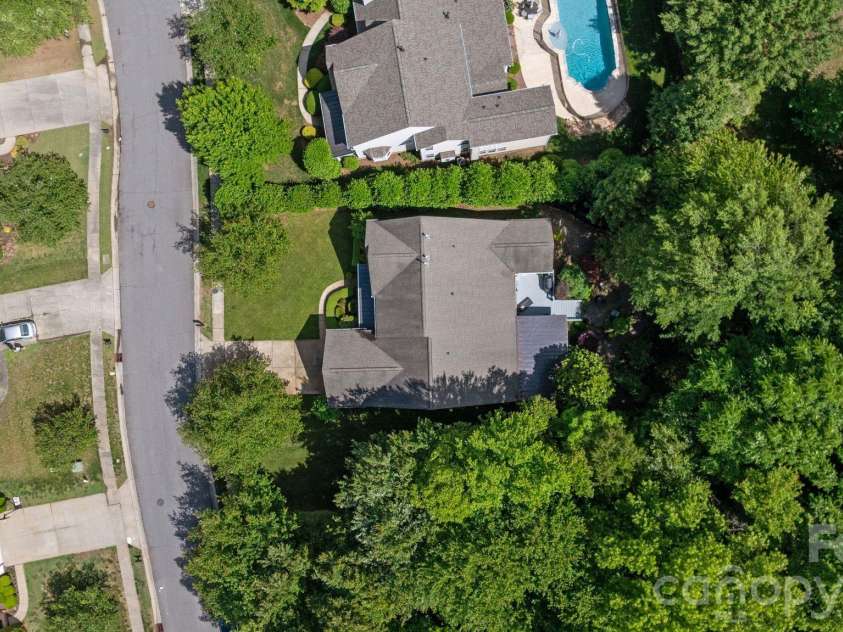 1020 Butterburr Drive, Matthews, NC 28104.  MLS# CAR4377677, YatesRealty ID 22378. HOA Walkway & Woods 