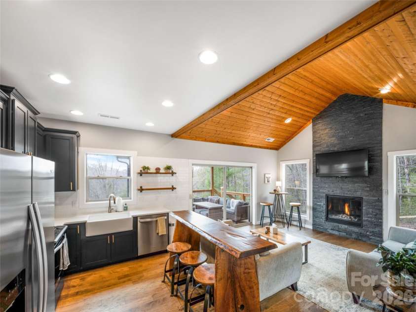 54 Weldon Way, Fairview, NC 28730.  MLS# CAR4353772, YatesRealty ID 22380. Open concept main level features vaulted ceilings and a beautiful gas fireplace. 