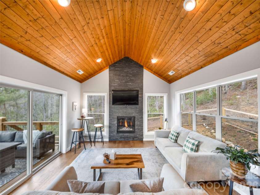 54 Weldon Way, Fairview, NC 28730.  MLS# CAR4353772, YatesRealty ID 22380. Parallel windows and sliding doors allow nature to be the backdrop of this home. 