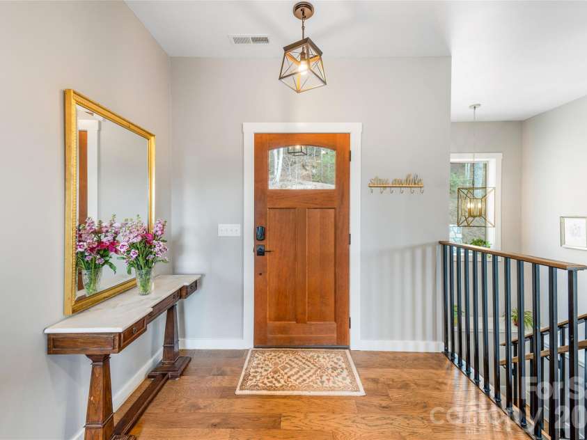 54 Weldon Way, Fairview, NC 28730.  MLS# CAR4353772, YatesRealty ID 22380. The main entrance - a beautiful craftsman style solid-wood door. 