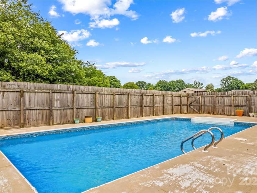296 Hicks Creek Road, Troutman, NC 28166.  MLS# CAR4266143, YatesRealty ID 22382. In Ground Pool with new Liner, New Pump