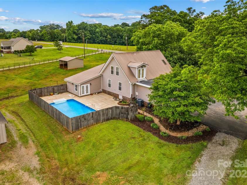 296 Hicks Creek Road, Troutman, NC 28166.  MLS# CAR4266143, YatesRealty ID 22382. In Ground Pool with Privacy Fence