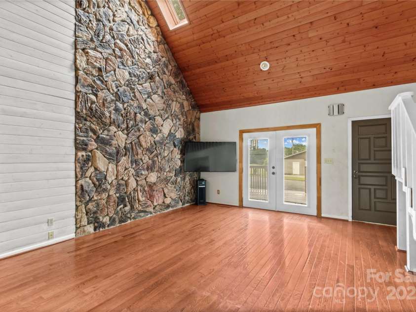 296 Hicks Creek Road, Troutman, NC 28166.  MLS# CAR4266143, YatesRealty ID 22382. Stone Accent Wall and Vaulted Great Room