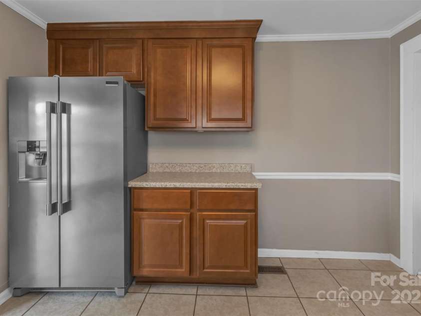 111 Church Street, Stanley, NC 28164.  MLS# CAR4260596, YatesRealty ID 22388. Like-new refrigerator that stays with the home.