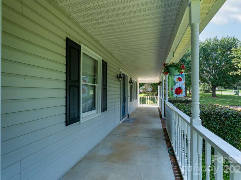 5211 Spring Glen, York, SC 29745.  MLS# CAR4270474, YatesRealty ID 22392. A great view of the rocking chair front porch which wraps around to the side porch
