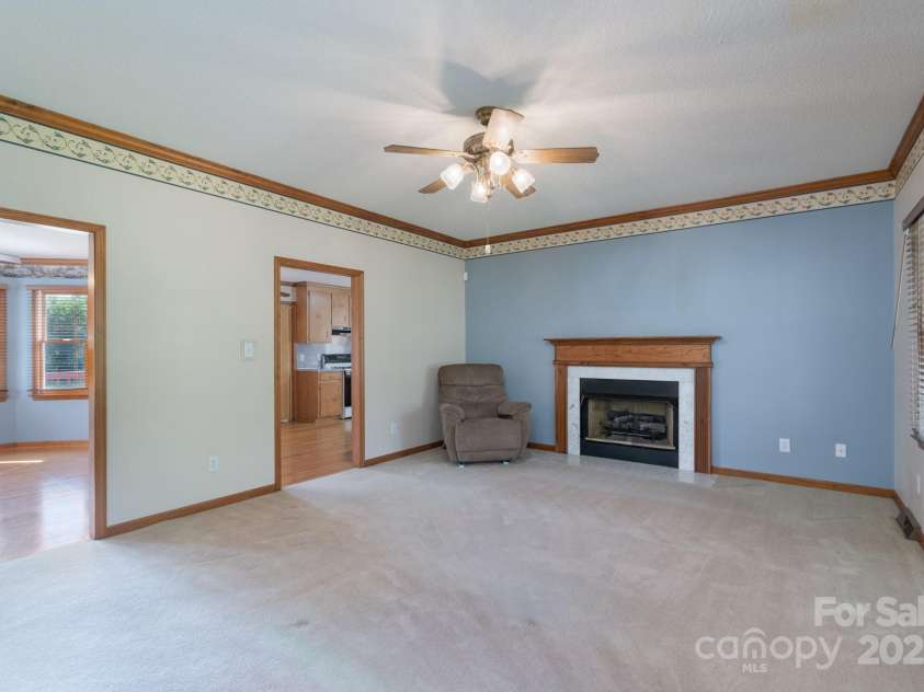 5211 Spring Glen, York, SC 29745.  MLS# CAR4270474, YatesRealty ID 22392. Awesome view of the living room showcasing a fireplace with mantle and gas logs