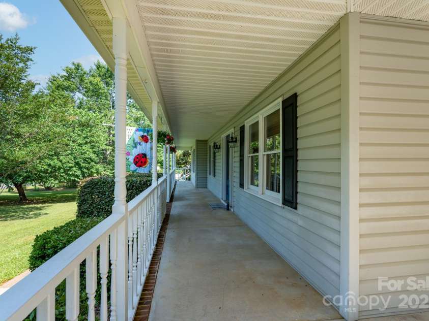 5211 Spring Glen, York, SC 29745.  MLS# CAR4270474, YatesRealty ID 22392. Front porch across front of house - perfect for rocking chairs and lots of plants