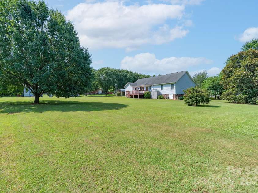 5211 Spring Glen, York, SC 29745.  MLS# CAR4270474, YatesRealty ID 22392. Full view of the back of the home - look how huge this yard is and all of the beautiful established trees!