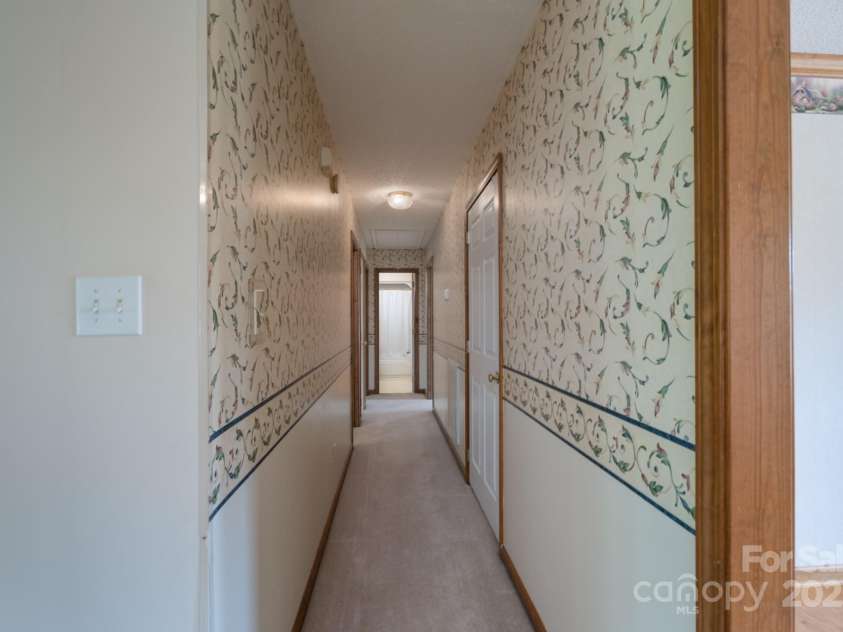 5211 Spring Glen, York, SC 29745.  MLS# CAR4270474, YatesRealty ID 22392. Hallway to the bedrooms and baths