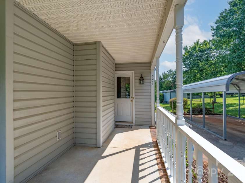 5211 Spring Glen, York, SC 29745.  MLS# CAR4270474, YatesRealty ID 22392. Side porch that wraps around from the front porch - back door entrance into the kitchen area