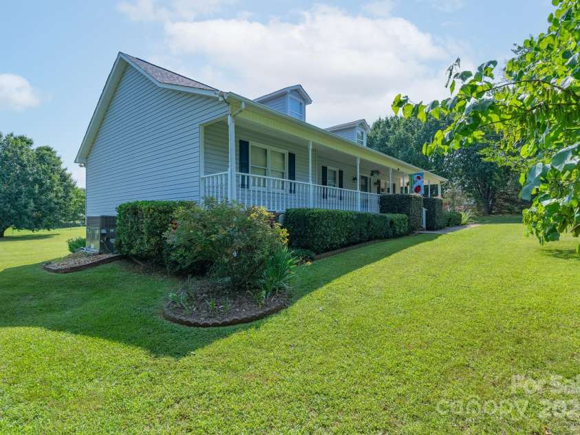 5211 Spring Glen, York, SC 29745.  MLS# CAR4270474, YatesRealty ID 22392. Side view of the home and beautiful lot