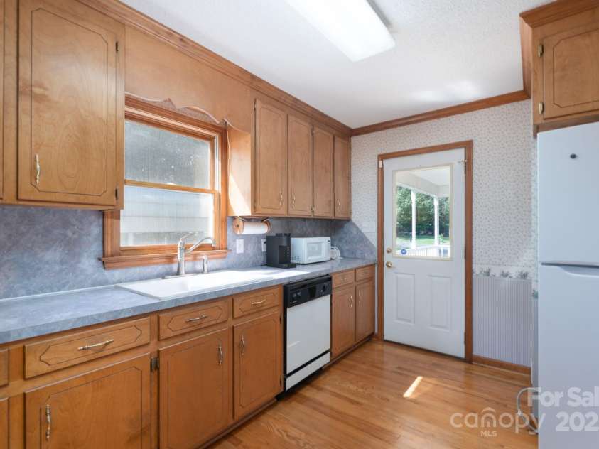 5211 Spring Glen, York, SC 29745.  MLS# CAR4270474, YatesRealty ID 22392. View of the kitchen leading to side/porch area