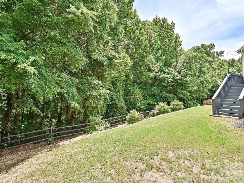 10234 Tintinhull Drive, Fort Mill, SC 29707.  MLS# CAR4375438, YatesRealty ID 22393. Fenced back yard