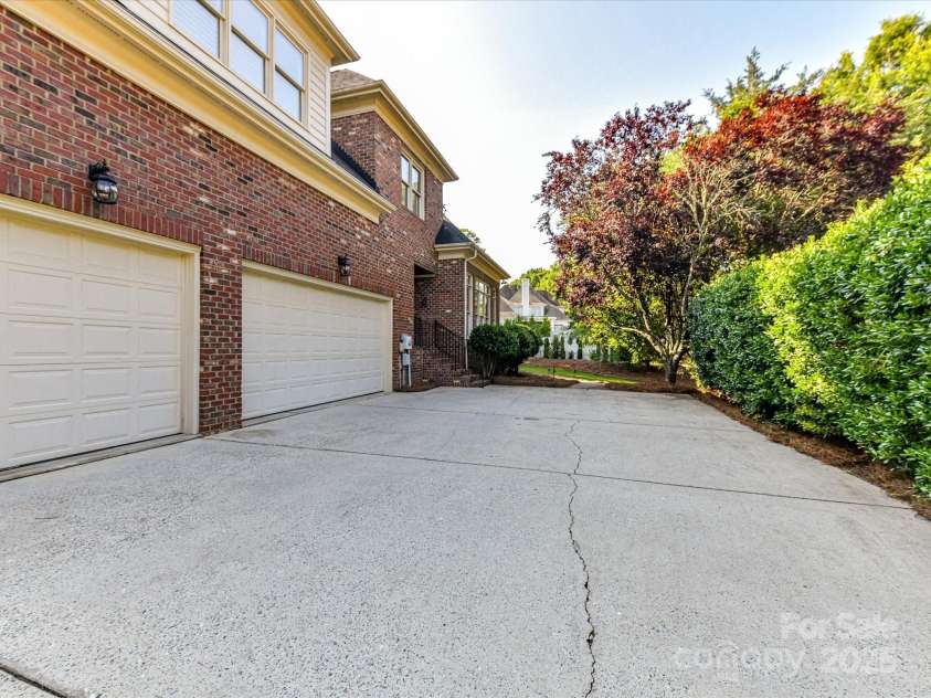 15009 Fanning Manor Court, Charlotte, NC 28277.  MLS# CAR4272630, YatesRealty ID 22393. 3+ car Garage w/extra width driveway.
