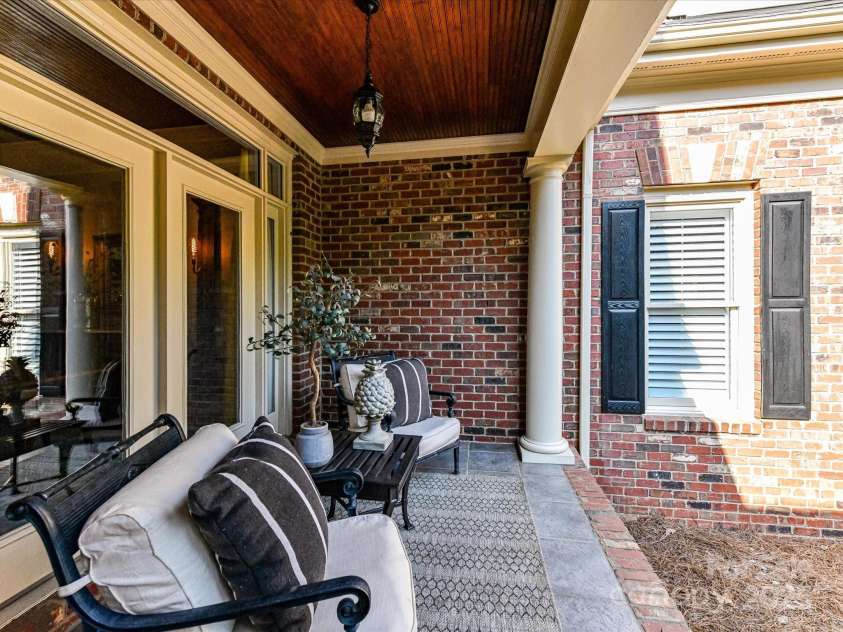 15009 Fanning Manor Court, Charlotte, NC 28277.  MLS# CAR4272630, YatesRealty ID 22393. Covered Front Porch w/beadboard ceiling detail.