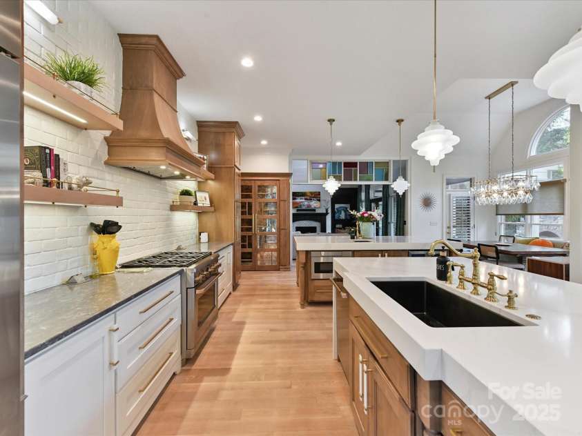 15009 Fanning Manor Court, Charlotte, NC 28277.  MLS# CAR4272630, YatesRealty ID 22393. Lighted Floating shelves & Furniture Armoire Coffee Bar & Pantry.