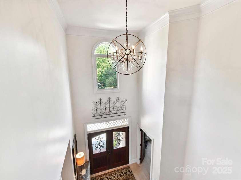 15009 Fanning Manor Court, Charlotte, NC 28277.  MLS# CAR4272630, YatesRealty ID 22393. Restoration Hardware foyer chandelier!