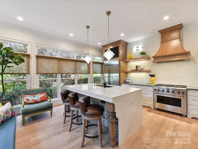 15009 Fanning Manor Court, Charlotte, NC 28277.  MLS# CAR4272630, YatesRealty ID 22393. Welcome to the totally high-end renovated Kitchen -Island Seating w/waterfall quartz.