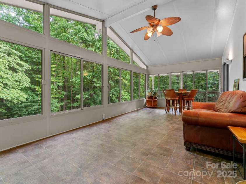 100 Tarragon Place, Flat Rock, NC 28731.  MLS# CAR4263342, YatesRealty ID 22395. Spacious Sunroom