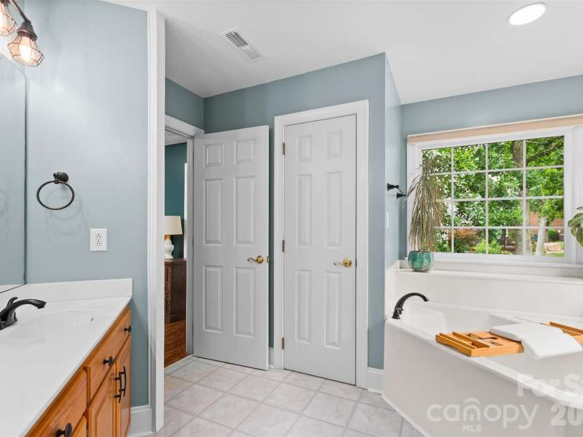 1305 Mill Race Lane, Matthews, NC 28104.  MLS# CAR4379571, YatesRealty ID 22399. Bathrooms feature fresh paint & updated hardware & fixtures