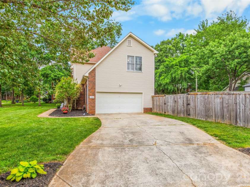 1305 Mill Race Lane, Matthews, NC 28104.  MLS# CAR4379571, YatesRealty ID 22399. Sideload garage