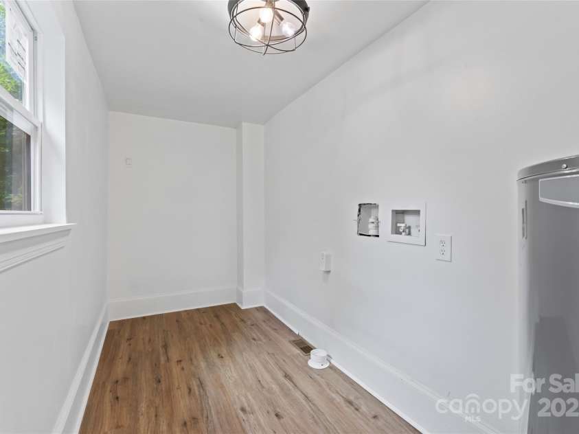 118 Cabarrus Avenue, Concord, NC 28025.  MLS# CAR4259694, YatesRealty ID 22401. Washer and dryer being installed.