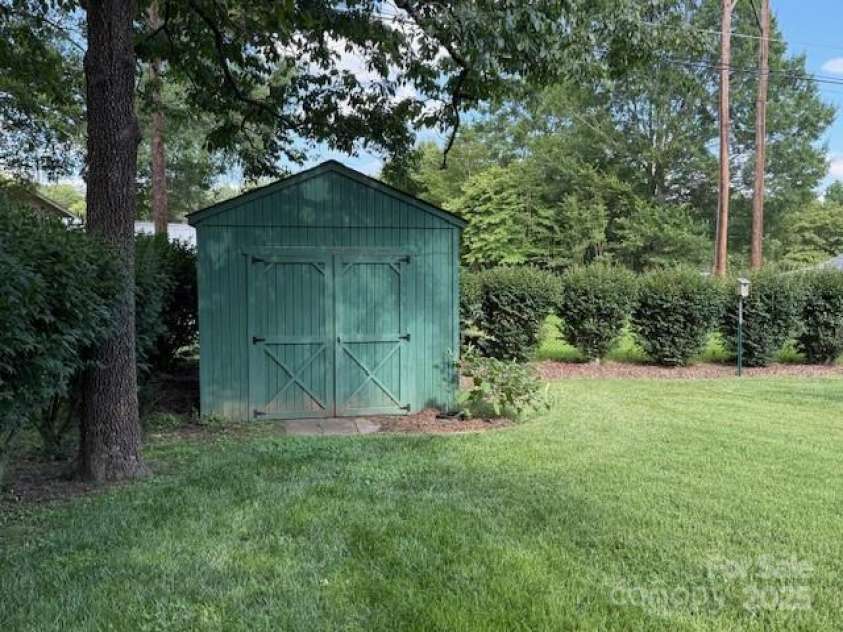 1116 Fieldstone Road, Mooresville, NC 28115.  MLS# CAR4271670, YatesRealty ID 22404. Storage shed