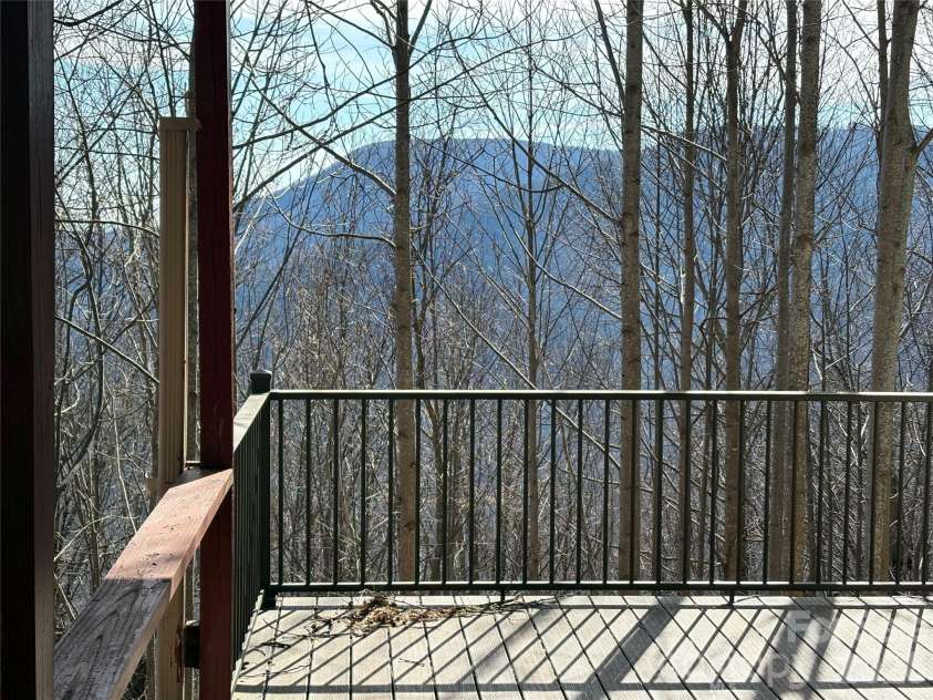700 Summit Road, Tryon, NC 28782.  MLS# CAR4344125, YatesRealty ID 2241. Fixer upper - views, gated mountain community with lake, buried utilities, water system.
