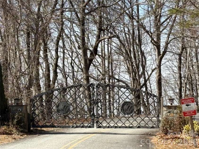 700 Summit Road, Tryon, NC 28782.  MLS# CAR4344125, YatesRealty ID 2241. One of the two gated entrances